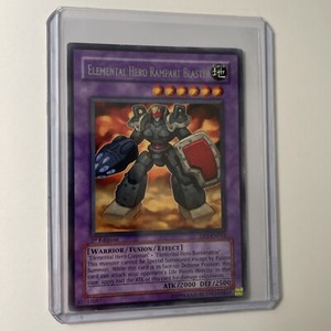 Yugioh Card Elemental Hero Rampart Blaster - DP1-EN012 - Rare 1st Edition MP-HP