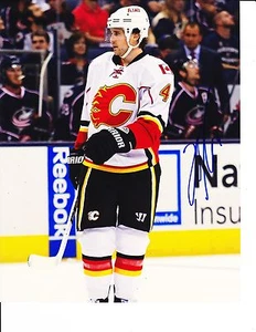 CALGARY FLAMES KRIS RUSSELL SIGNED WHITE JERSEY 8X10 - Picture 1 of 1