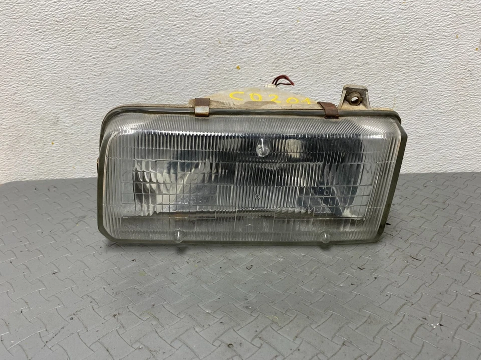 Faro lateral izquierdo Toyota Corolla FX 1987 OEM C0201 DG Foto 1 de 4