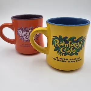 Juego de 2 tazas de café Rainforest Café Wild Place 13 oz naranja/amarillo púrpura/azul - Imagen 1 de 17