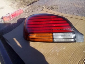 1996-1998 Pontiac Grand AM Left Tail Light Assembly GM# 16522027 - Picture 1 of 3