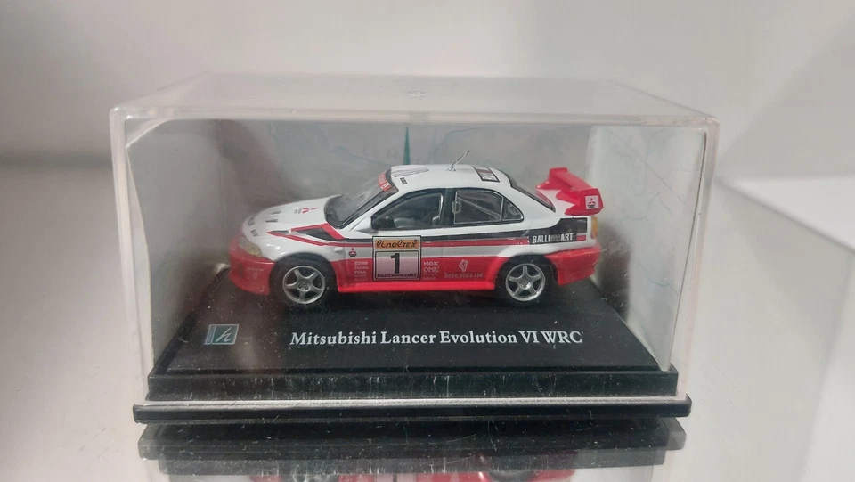 Hongwell 1:72 Mitsubishi Lancer Evolution VI WRC quasi nuovo nella scatola - Immagine 1 di 3