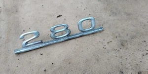 Mercedes Benz W114 280 Rear Trunk Emblem Badge 1148171115 USED AVERAGE SHAPE - Picture 1 of 1