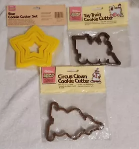 Máquina de galletas Wilton vintage apilable 6 estrellas, 1 tren y payaso cortadores de galletas (8) - Imagen 1 de 7