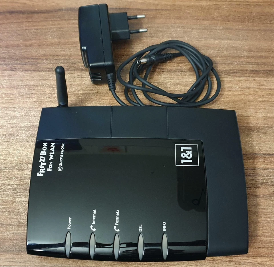 AVM FRITZBox Fon WLAN 7050 125 Mbps 2-Port 100 Mbps Router (20002306) + Netzteil - Bild 1 von 1