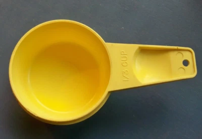 TUPPERWARE YELLOW NESTING MEASURING CUP 1/3 CUP - Image 1 of 4