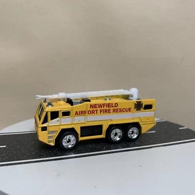 Matchbox Premiere Newfield Airport Fire Rescue Ladder Truck Yellow 1:124 Scale  - Image 1 of 4