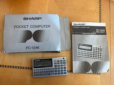 Vintage SHARP PC-1246 LCD BASIC pocket computer calculator - Image 1 of 4