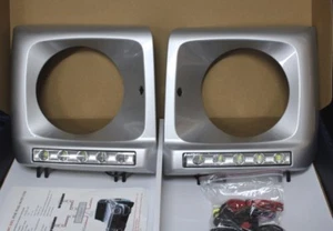 SCHEINWERFER UMRANDUNG MIT TAGFAHRLICHT MERCEDES W463 SILBER 775 - Picture 1 of 1