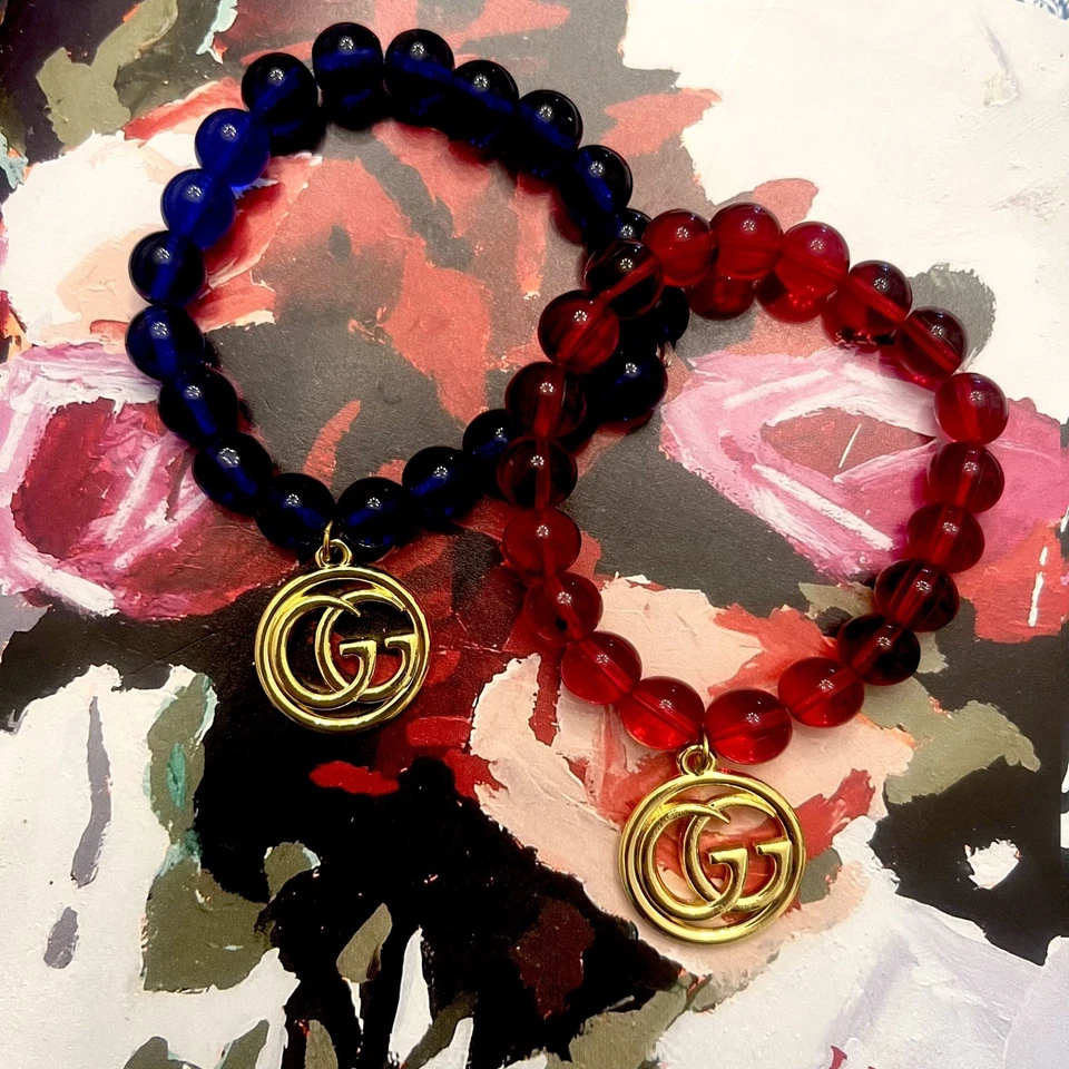 Lot Of (2) Glass Beads Red And Blue Stretch GG Bracelets - Image 1 of 4