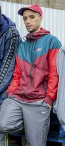 Nike Sportswear Windrunner Giacca a Vento Grigio Rosso Nylon Morbido Lucido S - Foto 1 di 6