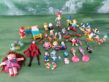 Lotto diversi pupazzetti Walt Disney Winnie Pooh Sailor Moon Simpson Calimero