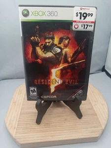 Resident Evil 5 (Microsoft Xbox 360, 2009) Estuche Promocional Tiene Pegatina Sin Libro - Imagen 1 de 11