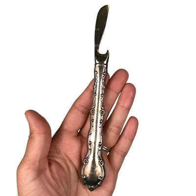 Cuchillo esparcidor de mantequilla plateado vintage con mango ornamentado abridor de botellas Foto 1 de 4