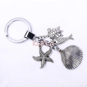 Llavero grande antiguo de metal con caparazón plateado pez tortuga estrella de mar animales marinos del océano - Imagen 1 de 2