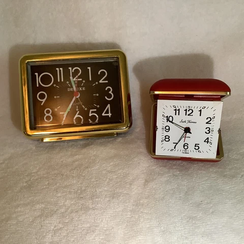 Vtg Travel Alarm Clocks- Metal Folding w/ Red Padded Case & Deluxe Plastic Case Cover