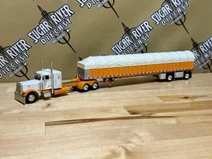 DCP 1/64 Peterbilt 379 Flattop With Covered Wagon Semi Truck Farm Toy Nib - Picture 1 of 11