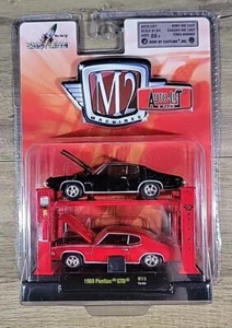 M2 Machines Auto Lift 1969 Pontiac GTO rot & schwarz - 2 Stück R13 15-04 - Bild 1 von 2