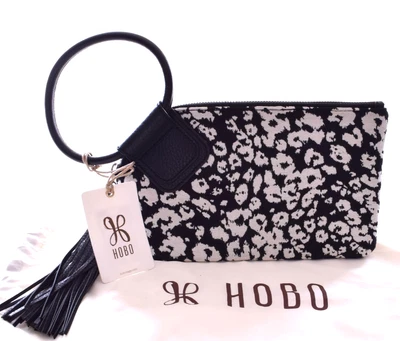 NUEVO CON ETIQUETAS HOBO INTERNATIONAL Muñequera Sable Borla Negro/Blanco Estampado Leopardo Foto 1 de 4