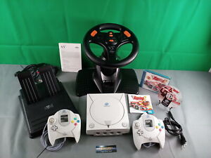 Sega Dreamcast PAL + 2 kontrolery Sega + kierownica + symulacja wyścigu 2 !! Dobry!!