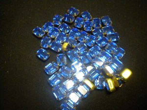 VINTAGE BLUE CRYSTAL IN A BRASS PRONG SETTING FOR SOLDERING OR ? 8x6 MM 50 PCS - Picture 1 of 1