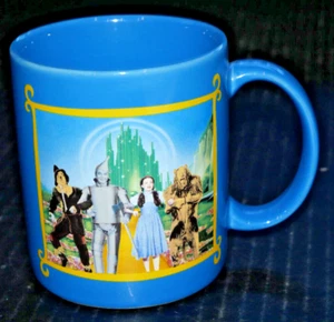 Taza El Mago de Oz Warner Bro Emerald City Dorothy Tin Man León Espantapájaros Azul - Imagen 1 de 3