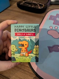 Happy Little Dinosaurs: Perils of Puberty (Board Game Expansion Pack) - Picture 1 of 2