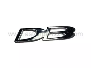 GENUINE ASTON MARTIN DB7 V12 VANTAGE REAR 'DB' BADGE - 78-81471. - Picture 1 of 2