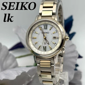 Orologio SEIKO LUKIA 1B25-0AV0 onda solare in titanio argento oro stile elegante - Foto 1 di 9