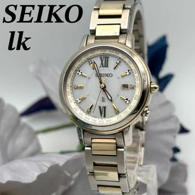 Orologio SEIKO LUKIA 1B25-0AV0 onda solare in titanio argento oro stile elegante - Immagine 1 di 4