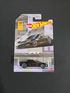 HOT WHEELS Themed - Chevy C6 Corvette (Corvette 70 1953-2023) 6/8 Black - Picture 1 of 2