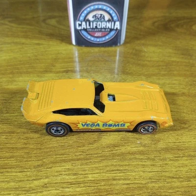 Tapa delantera Hot Wheels Flying Colors rueda Redline Vega Bomb naranja Hong Kong 1975 Foto 1 de 4