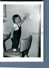 FOUND B&amp;W PHOTO N_2069 GIRL IN OVERALLS STANDING IN CHAIR BY LIGHT SWITCH