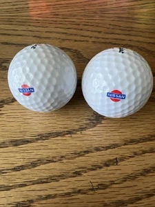 2 x Nissan Logo Golf Balls (2) Titleist DT 90 New - Picture 1 of 5
