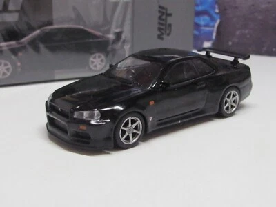 TSM/MINI GT - NISSAN SKYLINE GT-R NEGRO R34 - MODELO COCHE ESCALA 1:64 MGT00570-R Foto 1 de 4