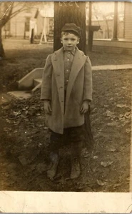 Vintage RPPC Photo Postcard Little Boy in Jacket Cap and Beat up Shoes C1910 - Picture 1 of 3
