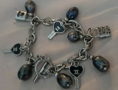Authentic CHANEL Bracelet toggle chain black beads with lock and key charms - Image 1 of 2