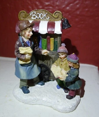Figura Grandeur Noel Village Book Wagon Merchant and Children 2002 RARA NAVIDAD Foto 1 de 4