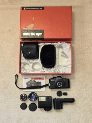 Pentax Auto 110 Super Camera Kit W/ Three Lenses, Flash, Winder, Boxed Working - Image 1 of 4