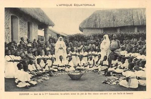 Uganda - First communion day, children around the party dish, each will be serve - Picture 1 of 2