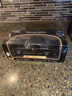 1965 Pontiac GTO Hurst 1/18 Maisto Special Edition black diecast car - Image 1 of 4