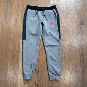 Pantalone Nike uomo M grigio tecnico foderato in pile Air Swoosh joggers conici tasche sottili - Foto 1 di 13