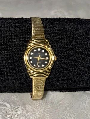 Reloj de cuarzo para dama GA esfera oscura piedra transparente tono dorado acero inoxidable leer vendido como está Foto 1 de 4