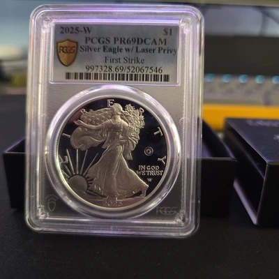 2025-W Proof $1 American Silver Eagle Laser Privy PR69DCAM First Strike Gold - Image 1 of 2