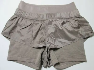 Pantaloncini sportivi Adidas donna taglia 36 beige elastico in vita tasche con zip foderati - Foto 1 di 8