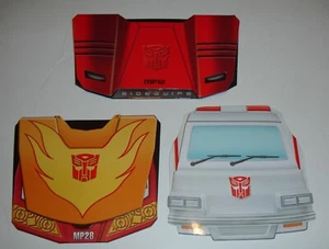 3 Transformers Masterpiece Coins New Ratchet,Hot rodimus,Sideswipe - Picture 1 of 2