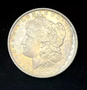 1887 $1 dollaro argento Morgan AU+ arcobaleno - Foto 1 di 3