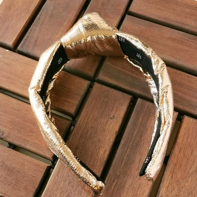 The Precious Metals Gold Metallic Faux Leather Knotted Headband comfortable - Image 1 of 3
