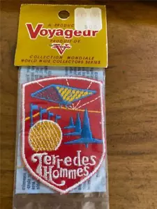 PARCHE DE RECUERDO DE COLECCIÓN TIERRA DE HOMBRE MONTREAL EXPO '67 VIAJERO COLECCIONISTA NUEVO EN PAQUETE - Imagen 1 de 2