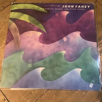 JOHN FAHEY - RAIN FORESTS OCEANS AND OTHER ROUNDER REC VG/VG+ Outer Rec Sleeve Foto 1 de 4